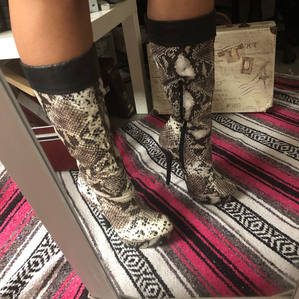 Calf-high, snake-print boots by Charlotte Russe.